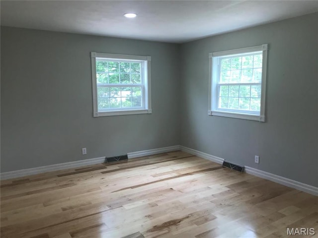 1202 S Gertrude St, Salem, MO 65560 - empty room featuring light wood-style floors and recessed lighting