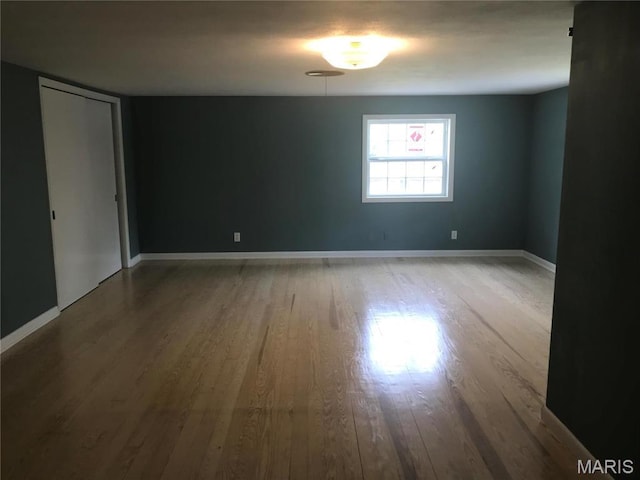 1202 S Gertrude St, Salem, MO 65560 - spare room featuring wood finished floors and baseboards