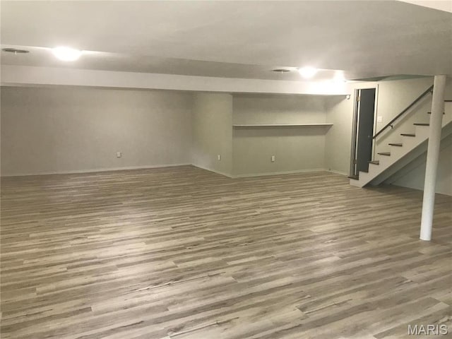 1202 S Gertrude St, Salem, MO 65560 - finished basement with wood finished floors and stairs