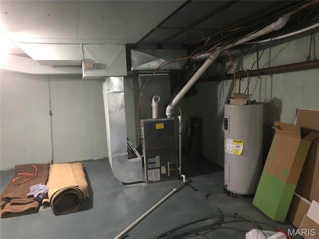 1202 S Gertrude St, Salem, MO 65560 - unfinished below grade area with water heater and heating unit