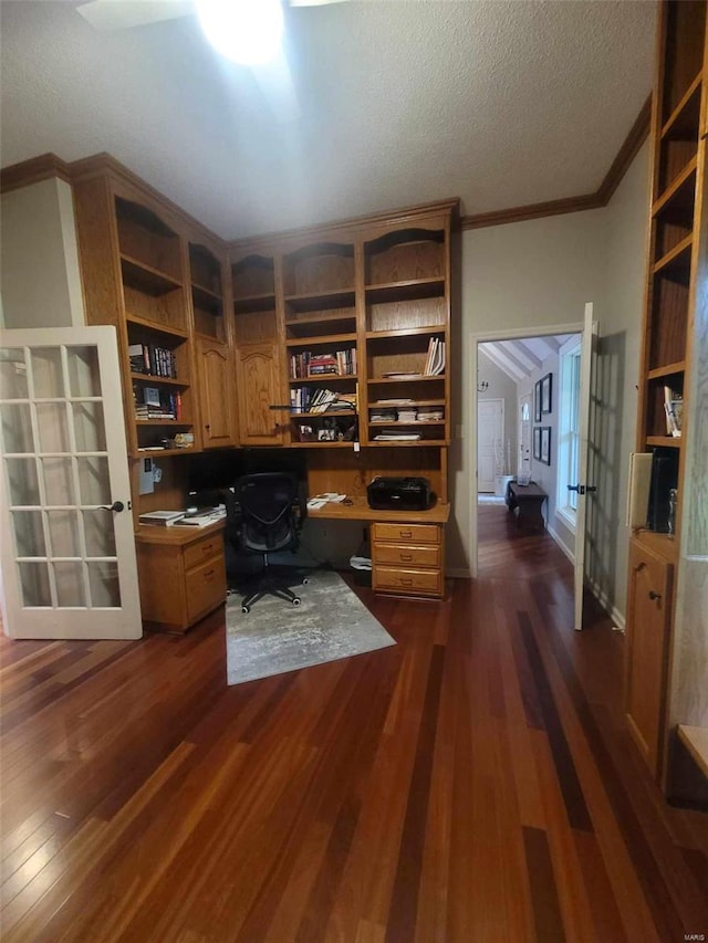 office with crown molding, dark wood-style floors, built in study area, a textured ceiling, and french doors