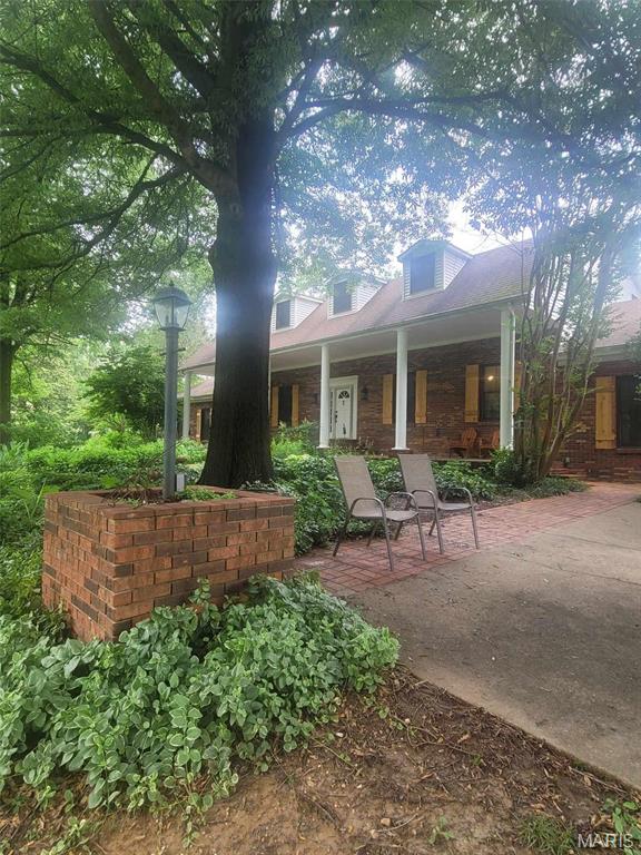 16225 Shady Ln, Dexter, MO 63841 - rear view of house featuring a porch