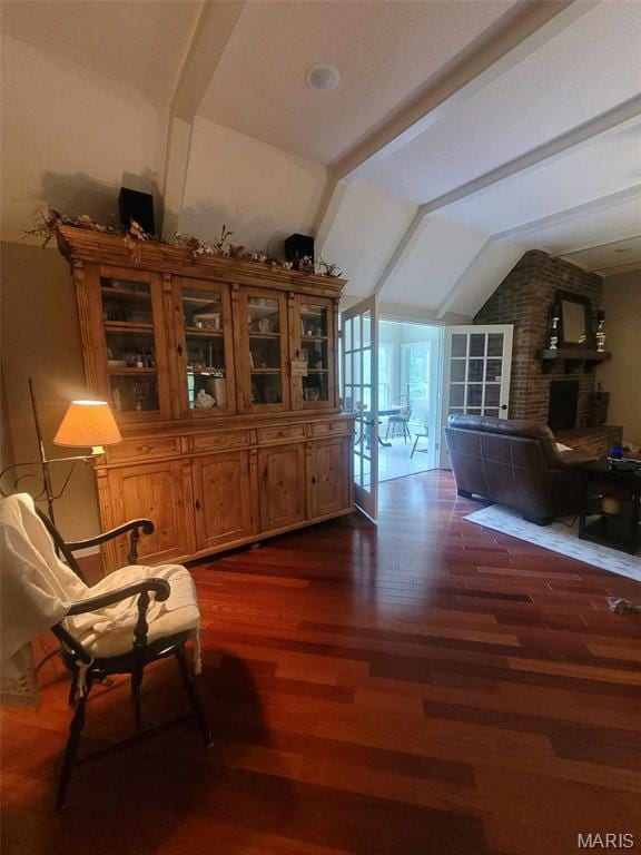 16225 Shady Ln, Dexter, MO 63841 - living area featuring dark wood-style flooring and a brick fireplace