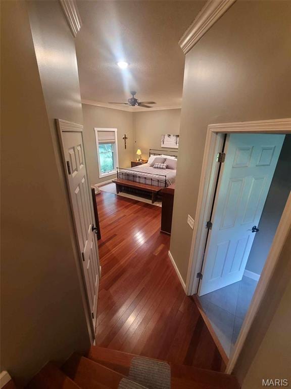 16225 Shady Ln, Dexter, MO 63841 - bedroom featuring dark wood-style flooring, ornamental molding, baseboards, and a ceiling fan