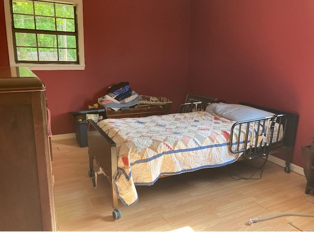 131 W Outer Rd, Poplar Bluff, MO 63901 - bedroom featuring light wood-type flooring and baseboards