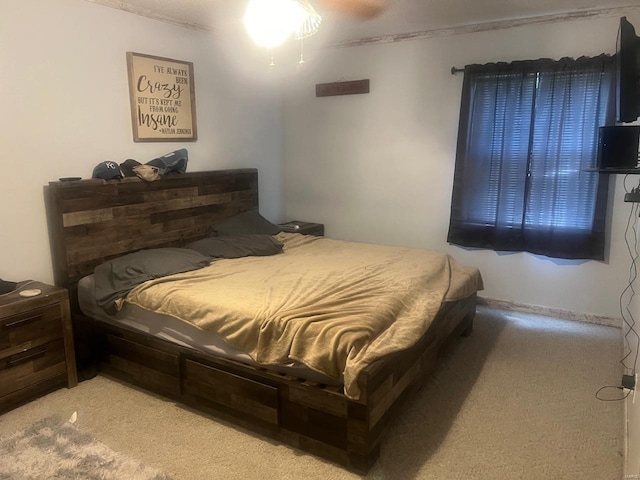 bedroom featuring light carpet