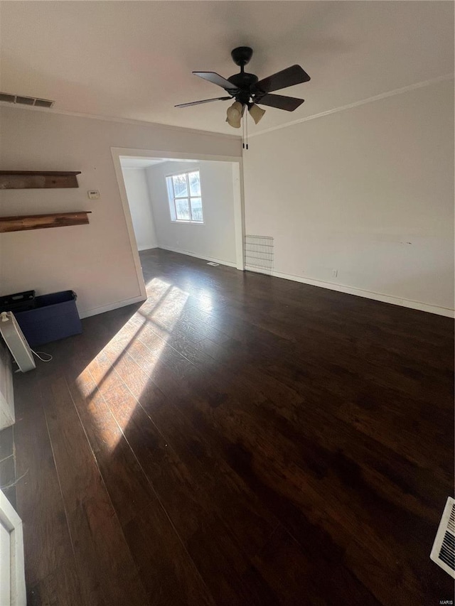 unfurnished living room with wood finished floors, a ceiling fan, and baseboards