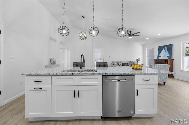 1523 Hickory Lndg, De Soto, MO 63020 - kitchen with dishwasher, a sink, white cabinets, baseboards, and lofted ceiling