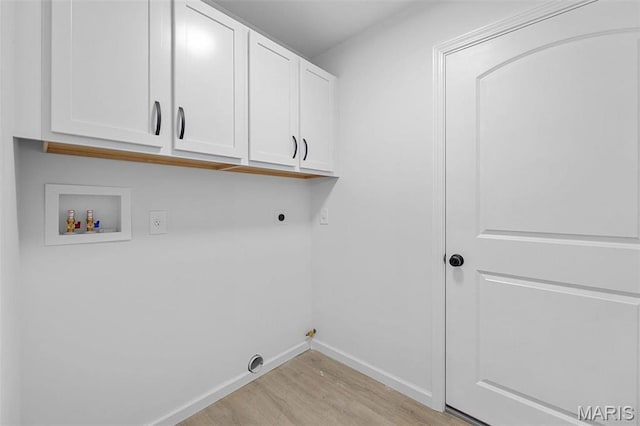 1523 Hickory Lndg, De Soto, MO 63020 - clothes washing area with hookup for a washing machine, cabinet space, light wood finished floors, hookup for an electric dryer, and baseboards