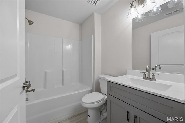 1523 Hickory Lndg, De Soto, MO 63020 - bathroom with toilet, vanity, tub / shower combination, and wood finished floors
