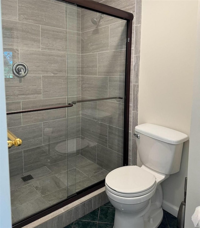 9002 Lumbert Ln, Lebanon, IL 62254 - full bath featuring tile patterned floors, toilet, baseboards, and a stall shower