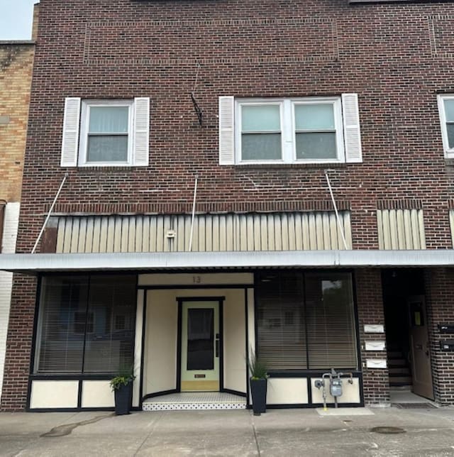 13 N Division St, Duquoin, IL 62832 - view of property featuring brick siding