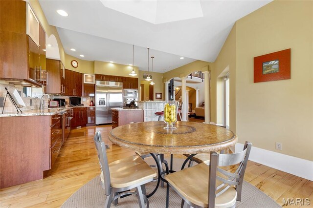 265 Deer Run Ln, Eureka, MO 63025 - dining area featuring light wood finished floors, recessed lighting, and a skylight