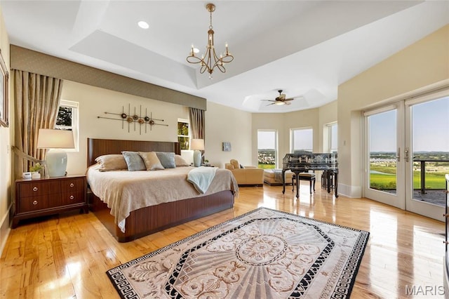 265 Deer Run Ln, Eureka, MO 63025 - bedroom with access to exterior, light wood-type flooring, french doors, and a chandelier