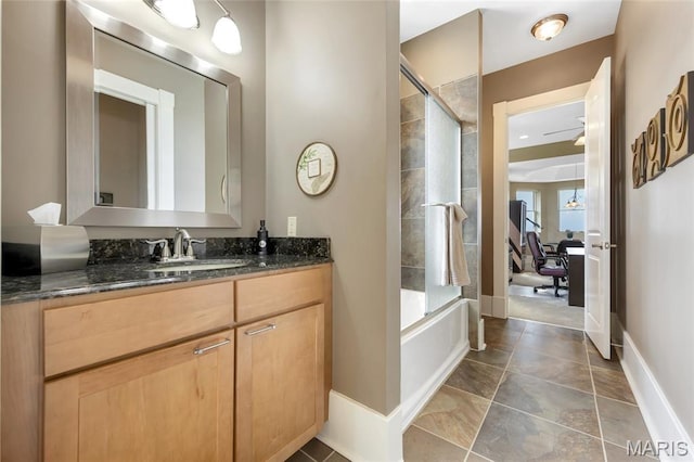265 Deer Run Ln, Eureka, MO 63025 - bathroom with vanity, washtub / shower combination, and baseboards
