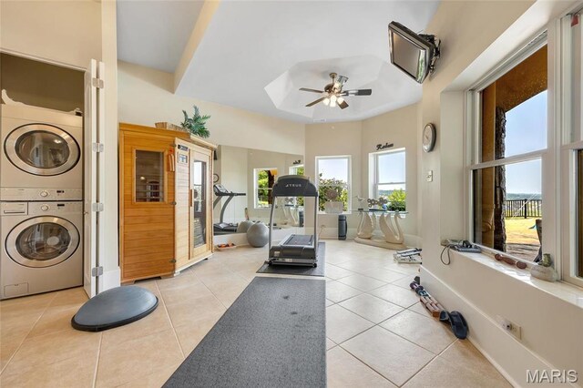 265 Deer Run Ln, Eureka, MO 63025 - workout room with estacked washer and dryer, ceiling fan, light tile patterned floors, and a skylight