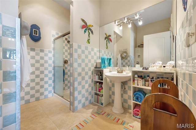 265 Deer Run Ln, Eureka, MO 63025 - bathroom with tile walls, a shower stall, tile patterned floors, and wainscoting