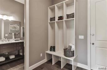 2626 Center Ave, Wildwood, MO 63040 - mudroom with baseboards, dark wood finished floors, and a sink