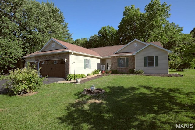 1710 Doe Run Dr, Vandalia, IL 62471 - ranch-style house with a garage, brick siding, a front yard, and driveway