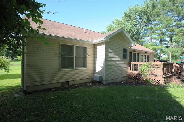 1710 Doe Run Dr, Vandalia, IL 62471 - view of side of property with a wooden deck, a yard, and a shingled roof