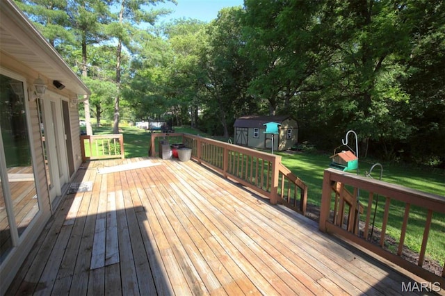 1710 Doe Run Dr, Vandalia, IL 62471 - deck with a shed, a yard, and view of scattered trees