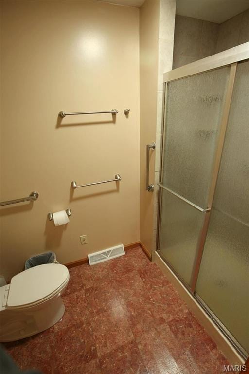 1710 Doe Run Dr, Vandalia, IL 62471 - bathroom with toilet and a shower stall