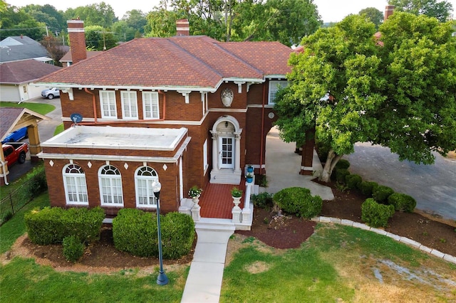 202 Poplar St, Harrisburg, IL 62946 - view of front of house with brick siding, a porch, and a chimney
