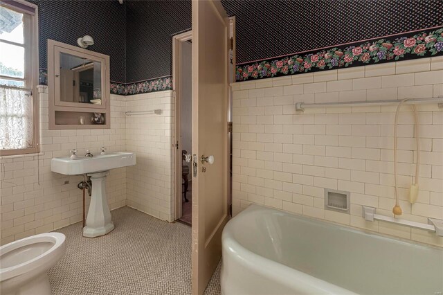 202 Poplar St, Harrisburg, IL 62946 - bathroom featuring tile walls, tile patterned flooring, and toilet