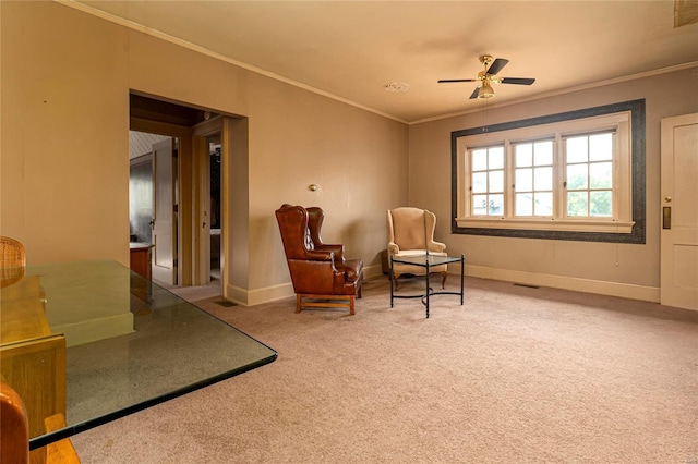 202 Poplar St, Harrisburg, IL 62946 - living area with ceiling fan, crown molding, carpet flooring, and baseboards