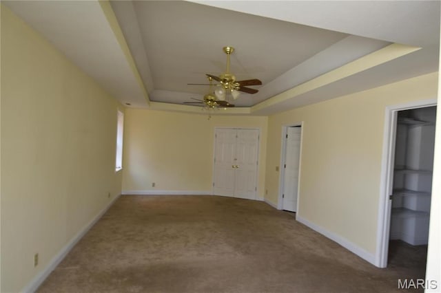 7617 Ivory Ave, Saint Louis, MO 63111 - carpeted empty room with a raised ceiling, a ceiling fan, and baseboards