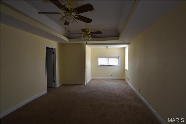 7617 Ivory Ave, Saint Louis, MO 63111 - carpeted spare room featuring a raised ceiling, ceiling fan, and baseboards