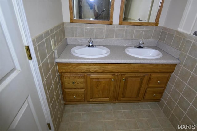 7617 Ivory Ave, Saint Louis, MO 63111 - full bathroom with double vanity and tile patterned flooring