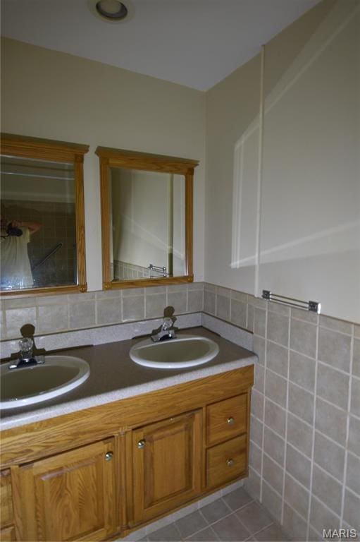 7617 Ivory Ave, Saint Louis, MO 63111 - bathroom with double vanity, tile patterned flooring, and tile walls