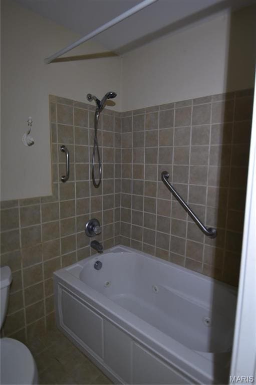 7617 Ivory Ave, Saint Louis, MO 63111 - full bath with toilet, tile walls, and a combined bath / shower with jetted tub