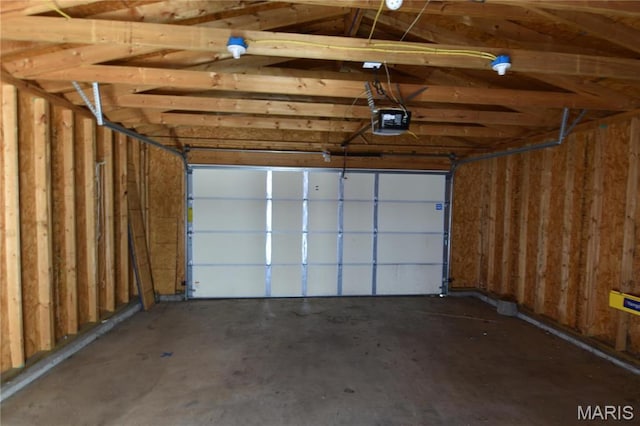 7617 Ivory Ave, Saint Louis, MO 63111 - garage featuring a garage door opener