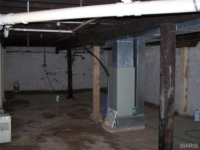 7617 Ivory Ave, Saint Louis, MO 63111 - unfinished basement featuring heating unit