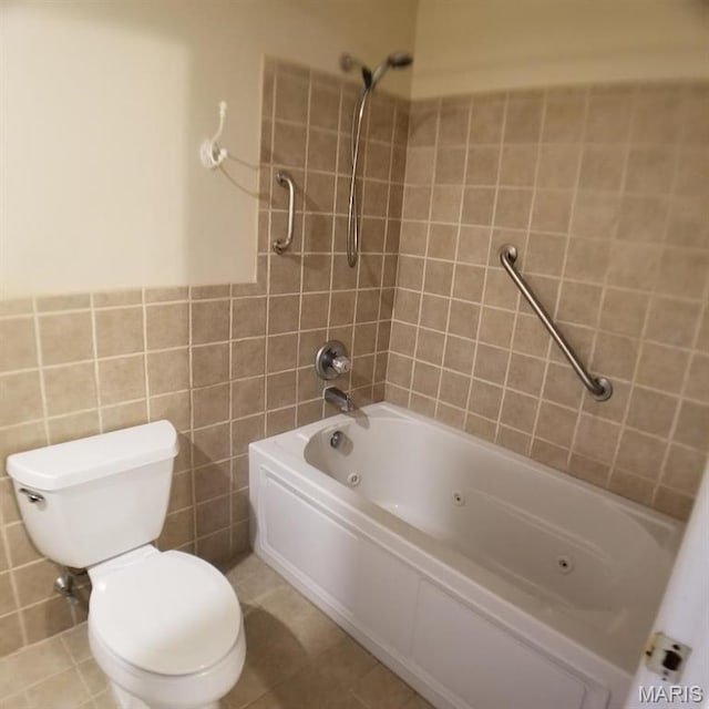 7617 Ivory Ave, Saint Louis, MO 63111 - full bath featuring toilet, a combined bath / shower with jetted tub, and tile walls