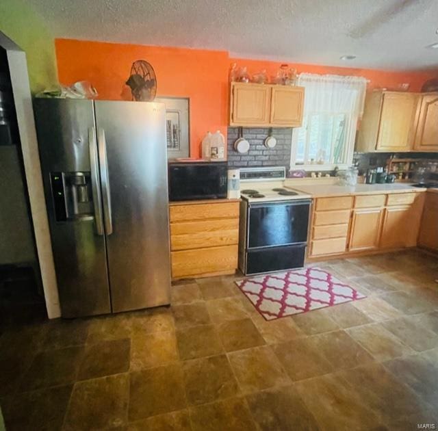 kitchen featuring stainless steel fridge, range with electric cooktop, light brown cabinets, a textured ceiling, and tasteful backsplash