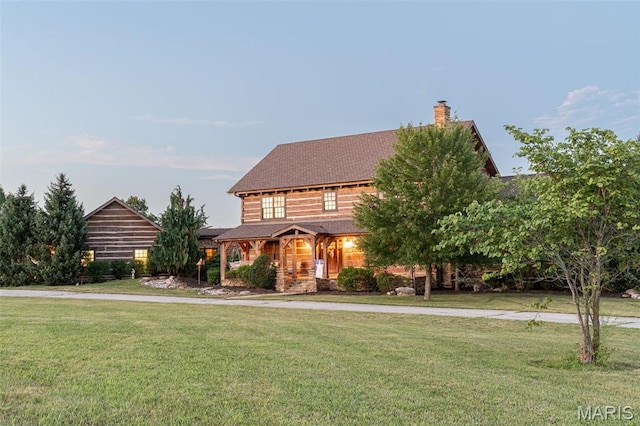 5140 Saint Anns Rd, Washington, MO 63090 - view of front of home with a front lawn and a chimney