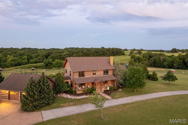 5140 Saint Anns Rd, Washington, MO 63090 - view of front facade with a front lawn, a porch, a chimney, concrete driveway, and an outbuilding