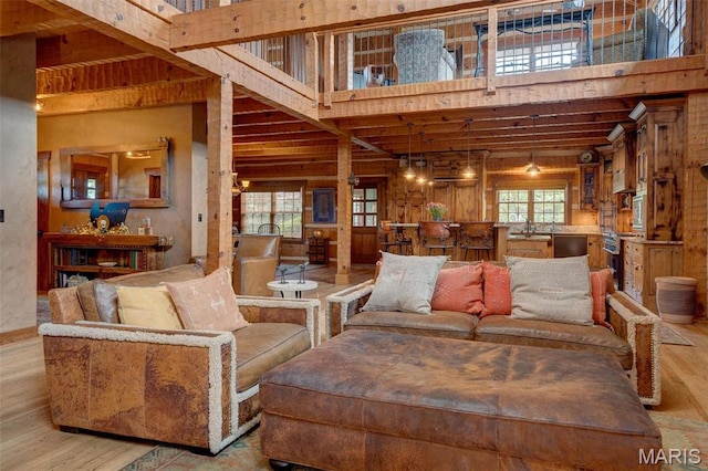 5140 Saint Anns Rd, Washington, MO 63090 - living area with wood finished floors, a high ceiling, and beam ceiling
