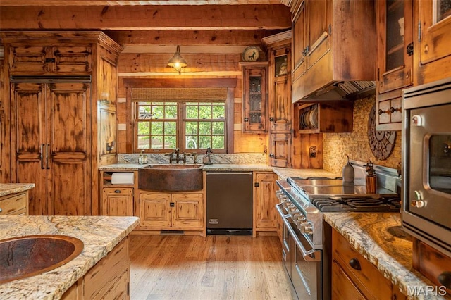 5140 Saint Anns Rd, Washington, MO 63090 - kitchen with double oven range, dishwasher, a sink, light wood-style floors, and beam ceiling