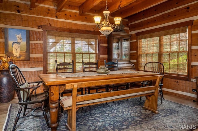 5140 Saint Anns Rd, Washington, MO 63090 - dining area with wood walls, healthy amount of natural light, beam ceiling, wood finished floors, and a chandelier