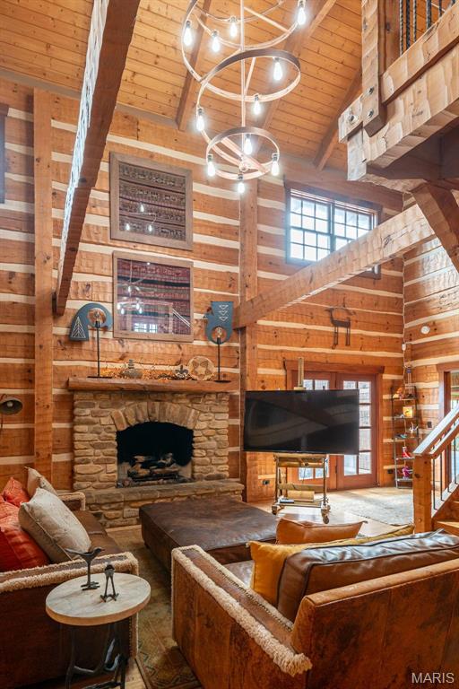 5140 Saint Anns Rd, Washington, MO 63090 - living area featuring wooden walls, high vaulted ceiling, wood ceiling with exposed beams, and a fireplace