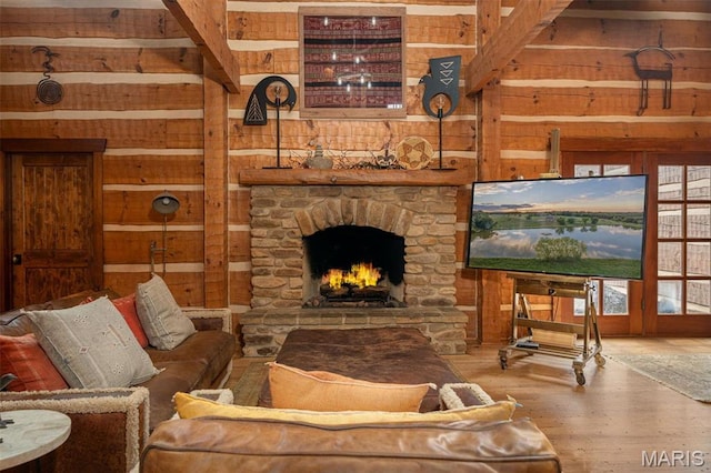 5140 Saint Anns Rd, Washington, MO 63090 - living area featuring wooden walls, wood finished floors, and a stone fireplace