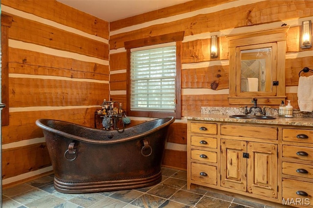 5140 Saint Anns Rd, Washington, MO 63090 - bathroom with wood walls, a freestanding bath, and vanity