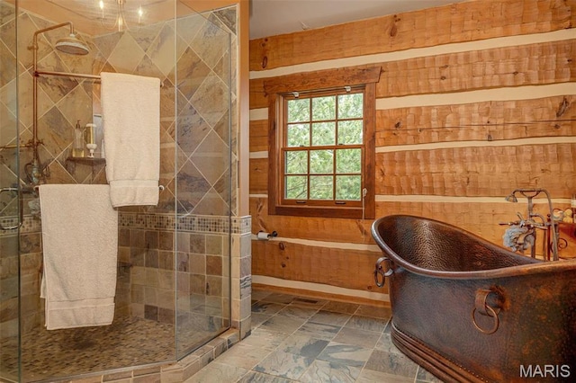 5140 Saint Anns Rd, Washington, MO 63090 - full bath featuring a freestanding tub, a stall shower, wooden walls, and stone finish flooring