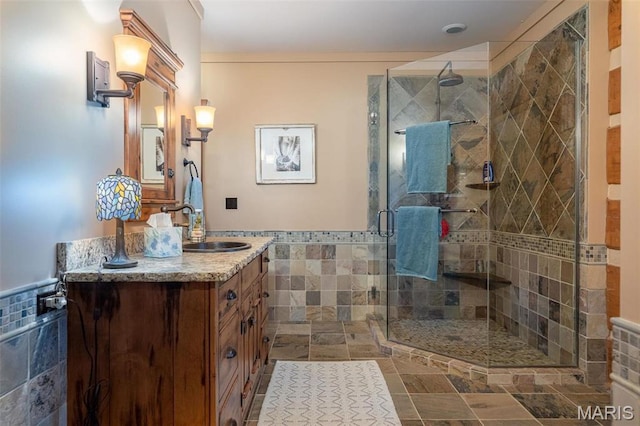 5140 Saint Anns Rd, Washington, MO 63090 - full bath featuring tile walls, vanity, a stall shower, and wainscoting