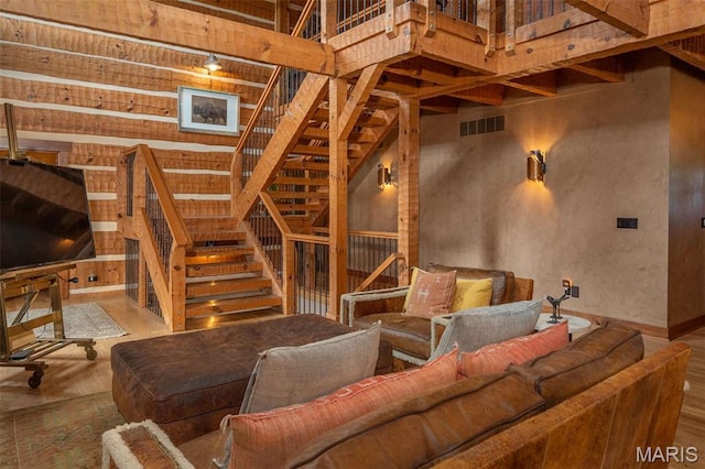 5140 Saint Anns Rd, Washington, MO 63090 - living area with a towering ceiling, stairway, and wood finished floors