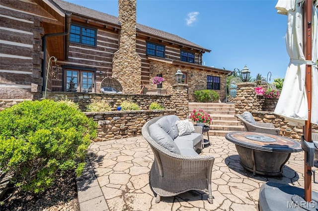5140 Saint Anns Rd, Washington, MO 63090 - view of patio featuring a fire pit and stairway